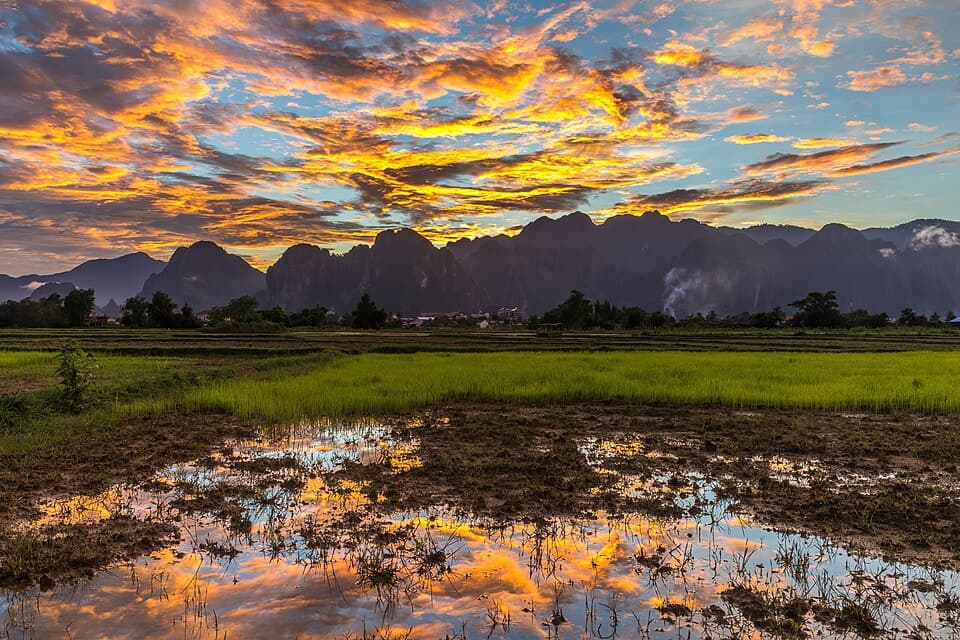 Colorful sky with orange clouds reflecting in the water of a by @benchwarlock — #4 in Photography